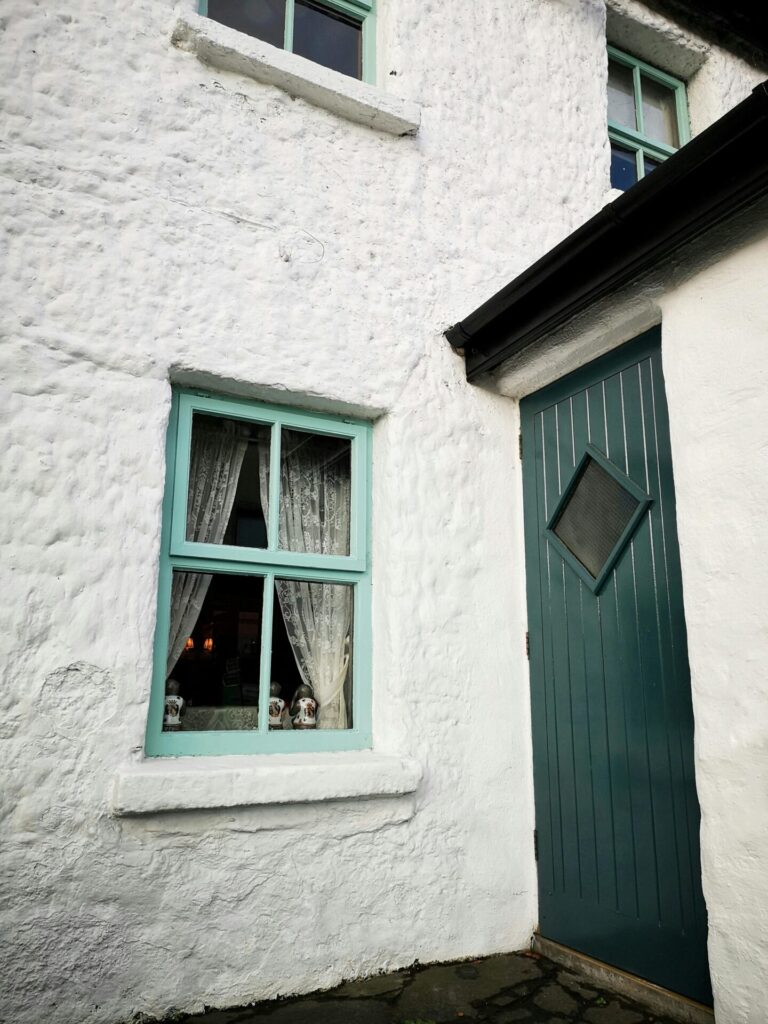 House front with blue door and blue windows