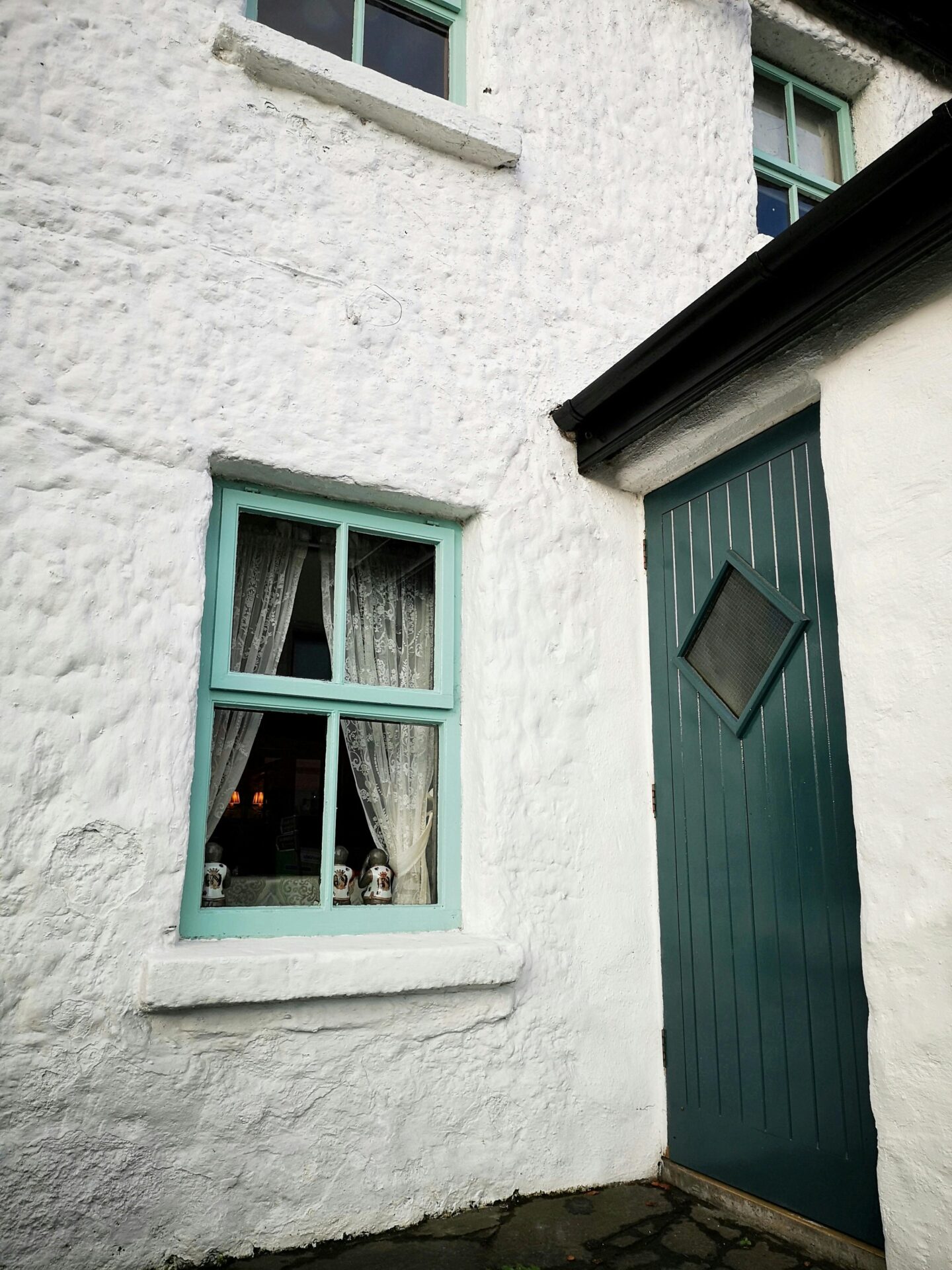 House front with blue door and blue windows